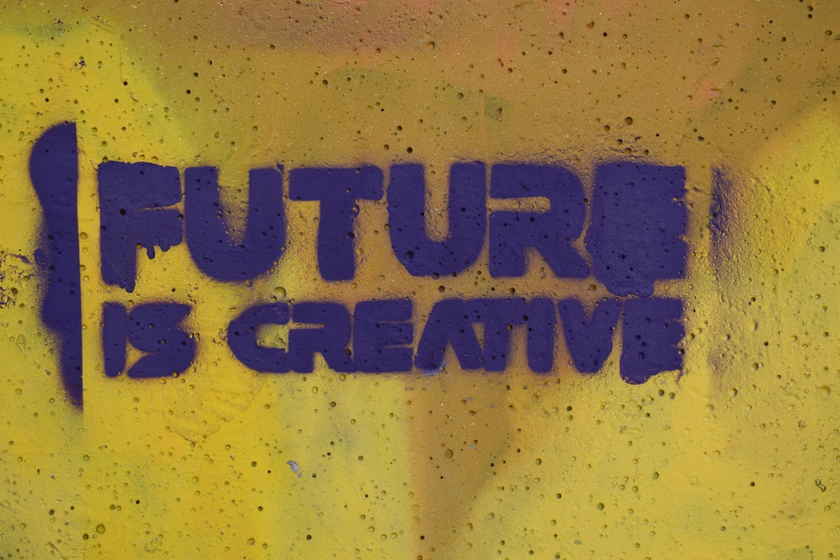 the words future is creative painted on a wall