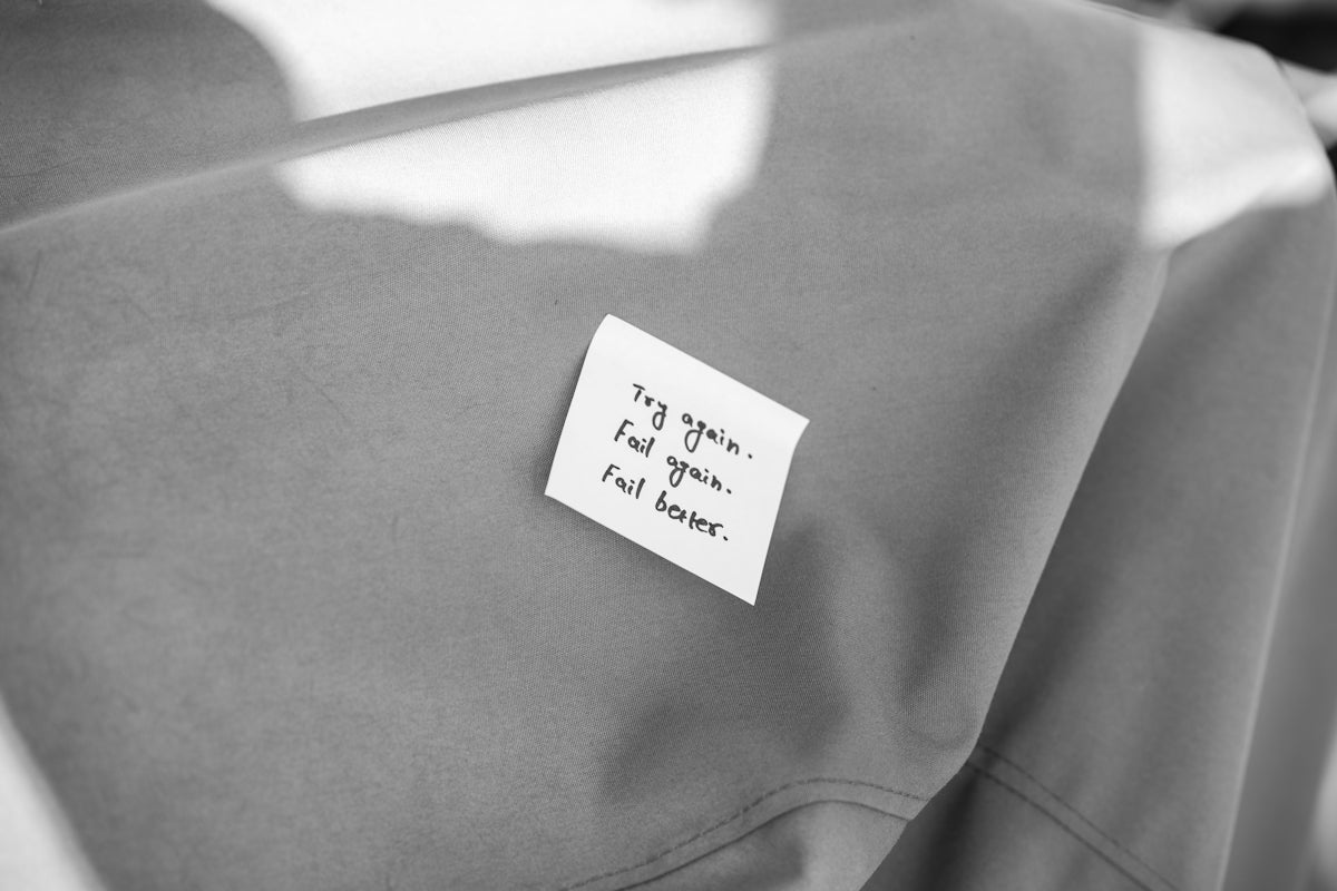 a piece of paper with a note attached to it