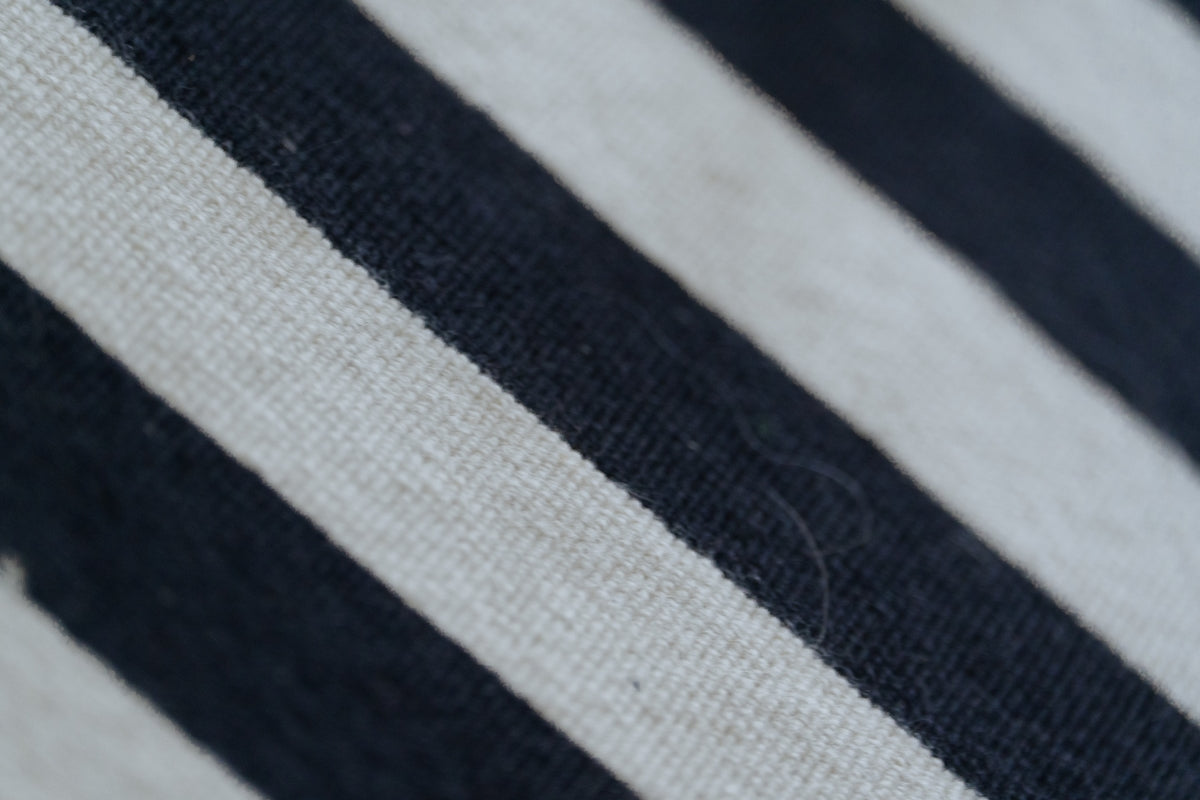 Black and white striped fabric, close-up.