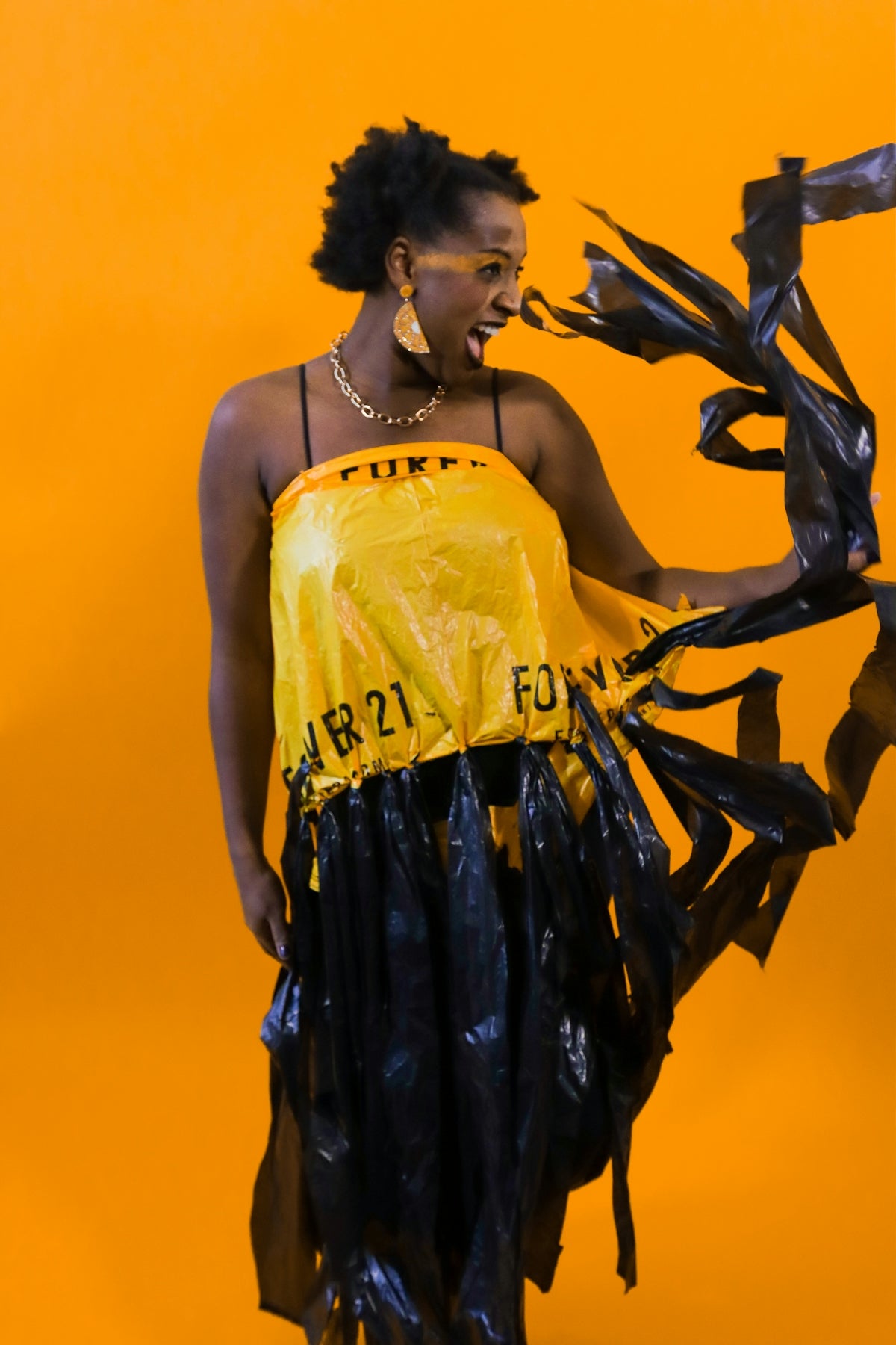 Woman in a creative yellow and black dress