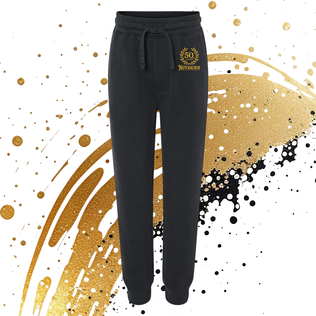Black sweatpants with a gold logo on a decorative background